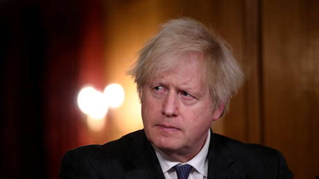 FILE PHOTO: UK PM Boris Johnson at a press briefing on the Covid crisis on January 22, 2021