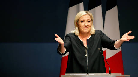 FILE PHOTO: Marine Le Pen waves before a speech for the next year's municipal elections in an end-summer annual address to partisans in Frejus, France September 15, 2019
