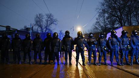 Chechen man arrested fleeing to Latvian border after video fighting Russian riot police goes viral