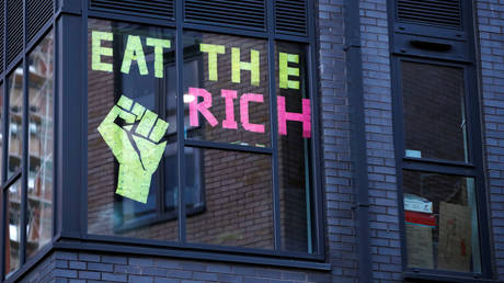 FILE PHOTO: Post-it notes reading "Eat The Rich" is seen on a student hall of residence building window, after new nationwide restrictions were announced during the coronavirus disease (COVID-19) outbreak in Bristol, Britain, November 3, 2020