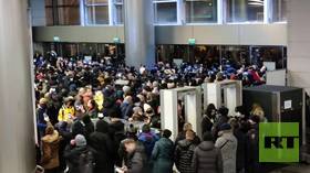 Riot police push crowd out of Moscow airport as opposition figure Navalny expected to land in Russia (VIDEO)