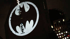 ‘This city needs a new hero’: Man in BATMAN suit arrested at unsanctioned rally in Moscow (PHOTOS)