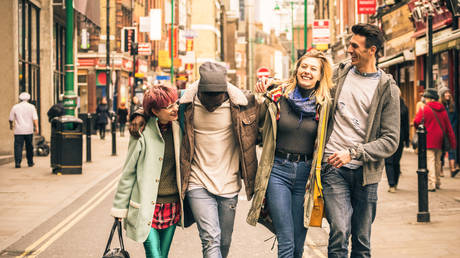 Friends walking on Brick Lane at Shoreditch London
