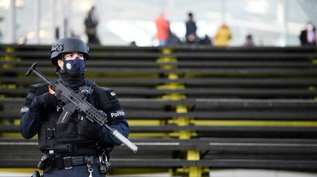 A police officer stands guard outside the court building in Antwerp, Belgium on February 4, 2021.