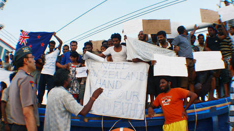 FILE PHOTO. Sri Lankan asylum seekers destined for Australia and New Zealand protest after their boat was captured by Indonesia National Police. ©Yuli Seperi / Getty Images