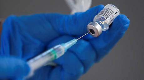 FILE PHOTO: A nurse fills a syringe with a second dose of the Pfizer-BioNTech COVID-19 vaccine, as the coronavirus disease (COVID-19) outbreak continues, at Enfermera Isabel Zendal new pandemic hospital in Madrid, Spain, February 4, 2021.