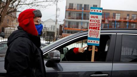 Chicago teachers are shown participating in a caravan late last month to make their case for school-reopening terms.