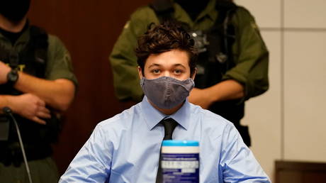 FILE PHOTO: Kyle Rittenhouse listens to defense attorney John Pierce during an court hearing in Waukegan, Illinois.