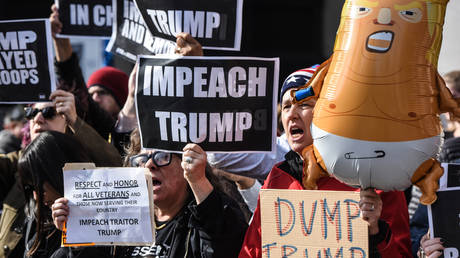 FILE PHOTO: People participate in a protest against U.S. President Donald Trump on Veterans Day on November 11, 2019 in New York City.