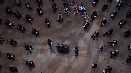 A memorial service is held for officer Brian Sicknick on February 3 in the US Capitol Rotunda.