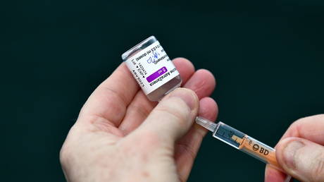 Dr Ray Walley, member of the GP COVID-19 Expert Advisory Group, prepares a dose of AstraZeneca coronavirus disease vaccine at an HSE vaccination centre outside St. Mary's Hospital, in Phoenix Park in Dublin, Ireland, February 14, 2021.