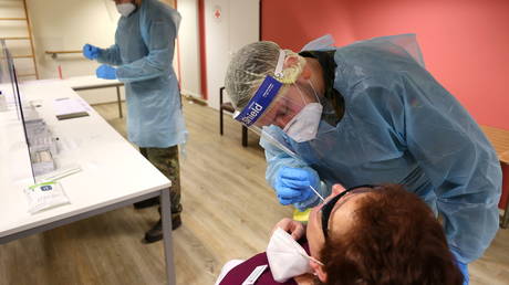 A person is tested for Covid-19 in Offenbach, Germany, February 2, 2021. © Kai Pfaffenbach / Reuters