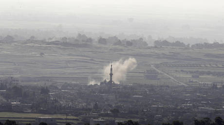 FILE PHOTO: Smoke rises after shells exploded in the Syrian village of Al Rafeed, close to the ceasefire line between Israel and Syria, as seen from the Israeli occupied Golan Heights May 7, 2013