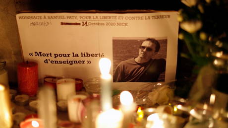 A makeshift memorial to murdered teacher Samuel Paty in Nice, France, October 2020. © Eric Gaillard / Reuters