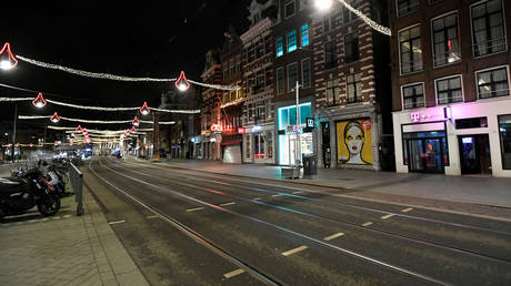 FILE PHOTO: An empty street is seen during a curfew in Amsterdam, Netherlands, January 23, 2021.