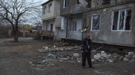 A man near a destroyed house in the city of Martakert in Nagorno-Karabakh. © RIA