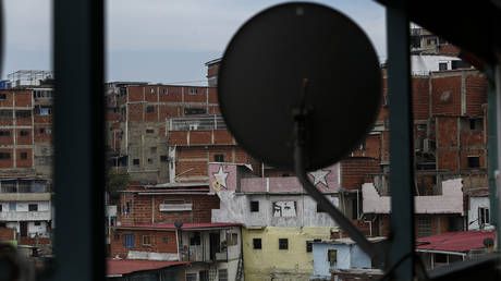 FILE PHOTO: An antenna is located on a terrace after the US television satellite operator DirectTV announced its withdrawal from Venezuela