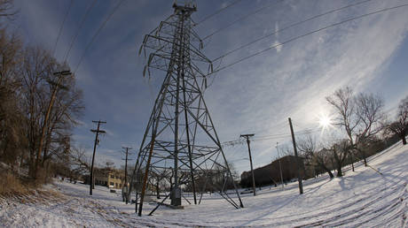 A transmission tower supports power lines after a snow storm on February 16, 2021 in Fort Worth, Texas