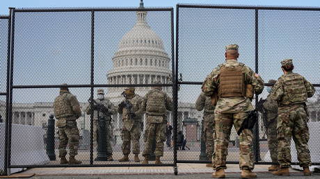 National Guard soldiers keep watch outside the US Capitol, in Washington, DC, January 14, 2021.