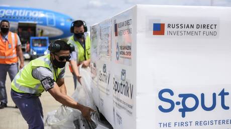 In this handout photo released by the government of Buenos Aires, a plane with Russia's coronavirus vaccine Gam-COVID-Vac, trade-named Sputnik V on board is unloaded upon arrival at Buenos Aires, Argentina.© Sputnik