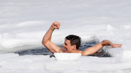 81m in one breath: Daredevil Czech free-diver sets new world record by holding out to swim under thick ice in frozen lake (VIDEO)
