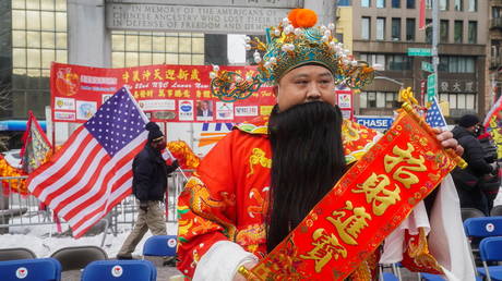 A man in a Chinese costume celebrates the Lunar New Year in the Chinatown area of Manhattan, New York City, February 12, 2021.