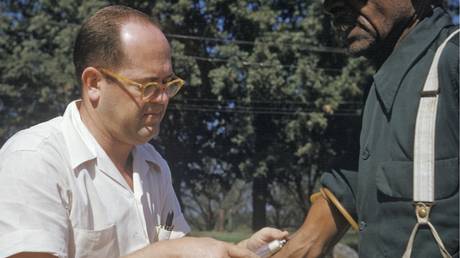FILE PHOTO: Black man included in a syphilis study has blood drawn by a doctor in Tuskegee, Ala.