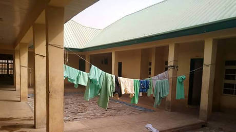 This photograph taken on February 26, 2021 shows school uniforms displayed inside the deserted school dormitory at Jangede, Zamfara State in northwest Nigeria © Habibu ILIYASU / AFP