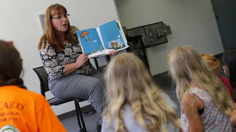 Librarian Marlayna Christensen is shown reading a Dr. Seuss book to children in San Diego in 2015.
