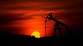 Oil climbs closer to $60 on growth hopes and OPEC+ supply cuts