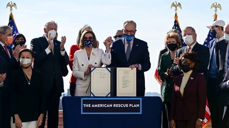 House and Senate Democrats celebrate the passage of the American Rescue Plan coronavirus bill, March 10, 2021.