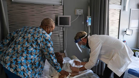FILE PHOTO: A nursing home resident receives a shot of the coronavirus vaccine at a nursing home facility in Brooklyn's Bath Beach neighborhood, in New York City, January 6, 2021.