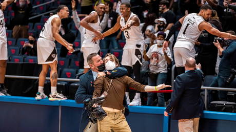 The 'chokehold' image at a US college basketball game went viral. © Griffin Quinn / Flyer News via Reuters