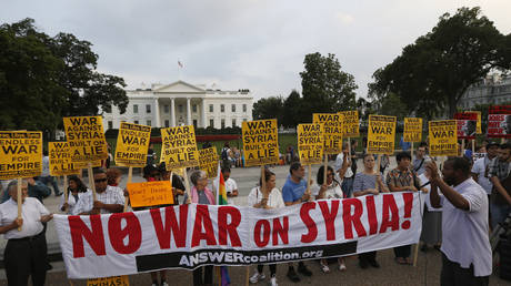 FILE PHOTO: The "Act now to stop war and end racism" (ANSWER) coalition holds a rally against the US-led military action on Syria outside the White House in Washington, August 29, 2013