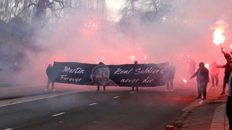 Ajax ultras honor &lsquo;notorious hooligan&rsquo; who was gunned down in &lsquo;gangland revenge hit&rsquo; as he collected daughter, 7, from school