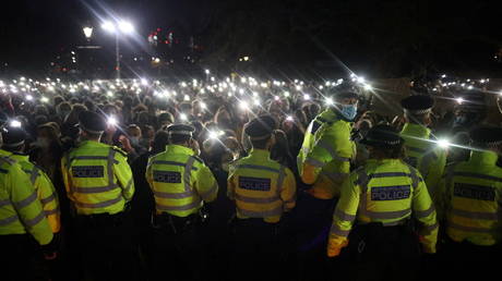 FILE PHOTO: Police members stand guard as people gather at a memorial site in Clapham Common Bandstand, following the kidnap and murder of Sarah Everard, in London, Britain March 13, 2021