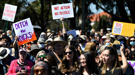 Protesters attend a rally against sexual violence and gender inequality in Australia's capital city Canberra on March 15, 2021.© AFP / Saeed KHAN