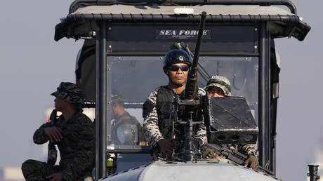 FILE PHOTO: Members of Philippine Navy's NAVSOG hold their weapons aboard a patrol boat in Manila November 13, 2015.