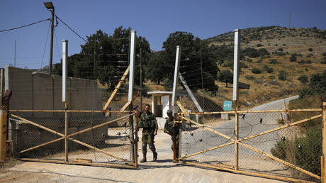 FILE PHOTO: Israeli soldiers open the gate an Israeli military base