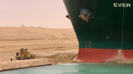 FILE PHOTO. A container ship which was hit by strong wind and ran aground is pictured in Suez Canal, Egypt March 24, 2021. © AFP / SUEZ CANAL