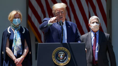 Dr. Deborah Birx (left) and Dr. Anthony Fauci (right) flank US President Donald Trump during a Covid-19 press conference at the White House, May 15, 2020.