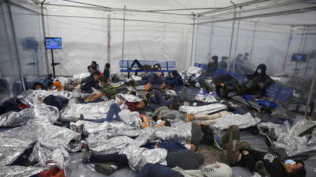 Migrants crowded inside the US Customs and Border Protection detention facility in Donna, Texas, March 30, 2021.