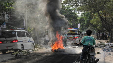 A fire burns on the street during a protest against the military coup, in Mandalay, Myanmar on April 1, 2021.