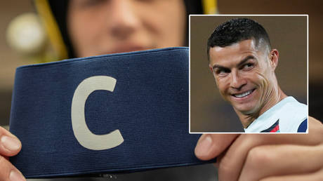‘We could not believe it’: Cristiano Ronaldo’s armband, which he hurled away after goal scandal in Serbia, is flogged at auction