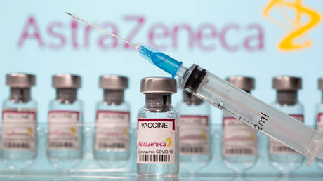 FILE PHOTO: Vials labelled "AstraZeneca COVID-19 Coronavirus Vaccine" and a syringe are seen in front of a displayed AstraZeneca logo in this illustration taken March 10, 2021.