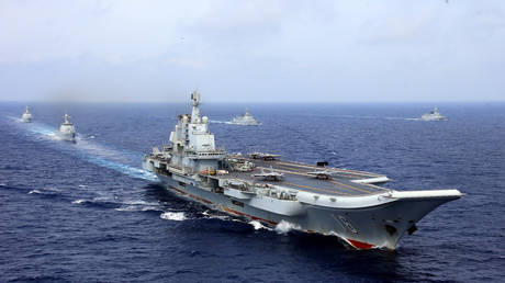 FILE PHOTO: China's aircraft carrier Liaoning takes part in a military drill of Chinese People's Liberation Army (PLA) Navy in the western Pacific Ocean, April 18, 2018