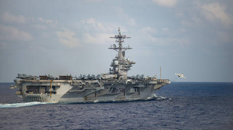 FILE PHOTO. An F/A-18F Super Hornet launches from the flight deck of the USS Theodore Roosevelt.