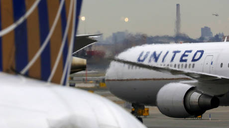 FILE PHOTO: A United Airlines passenger jet taxis at Newark Liberty International Airport, New Jersey, U.S. December 6, 2019.