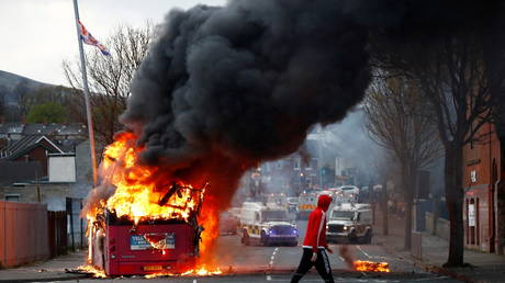 The bus burning on the Shankill Road as protests continue in Belfast, Northern Ireland on April 7, 2021. © REUTERS/Jason Cairnduff