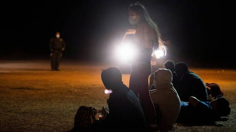 Unaccompanied minor migrants are detained by the US Border Patrols after crossing the Rio Grande River from Mexico in La Joya, Texas, April 7, 2021.